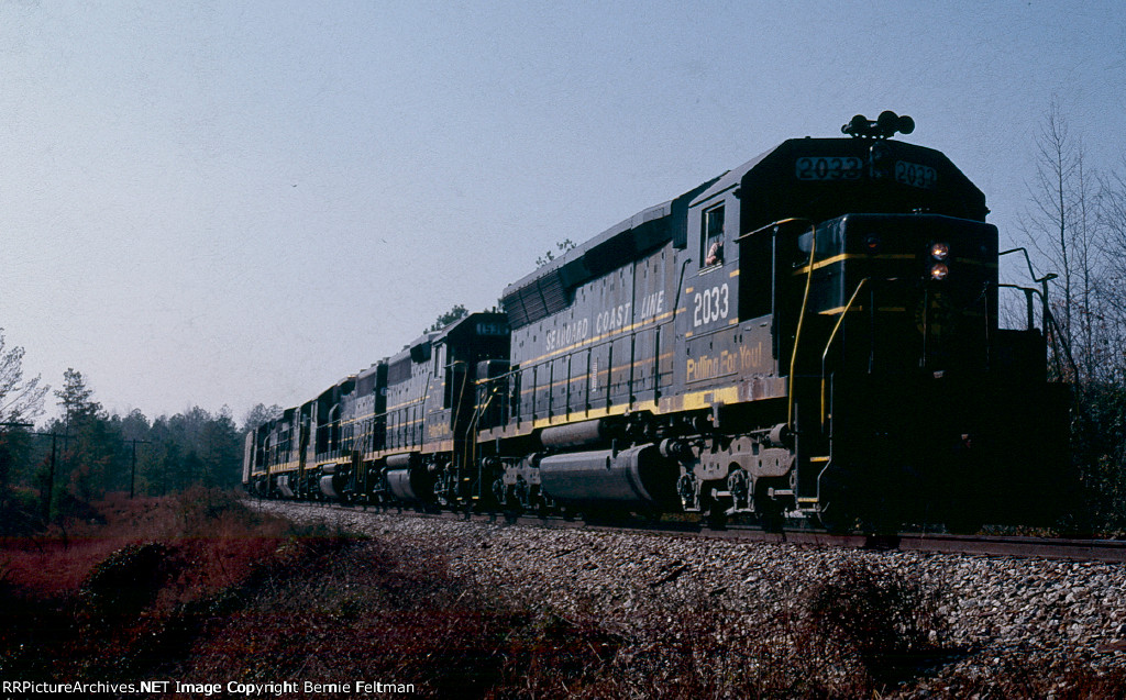 Seaboard Coast Line SD45 #2033 (with GP40's #1530 &amp; 1532, U36B #1758 &amp; GP40 #1627) lead 150 car southbound train #385 